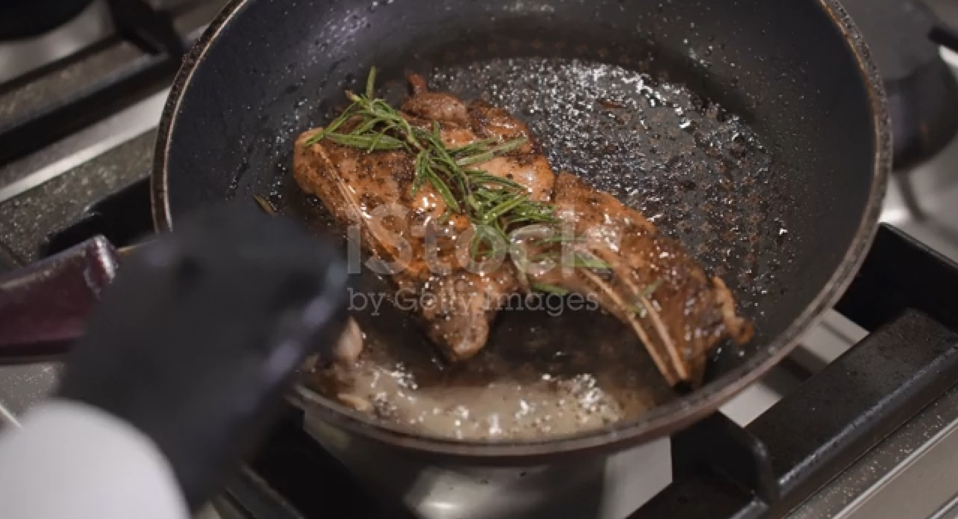 steak cooking in skillet